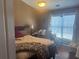 Cozy bedroom features a window with natural light and a comfortable bed at 2610 Gadsen Walk, Duluth, GA 30097