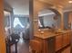 Modern kitchen with stainless steel appliances and granite countertops, opening to the living room at 2610 Gadsen Walk, Duluth, GA 30097