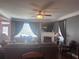 Cozy living room with fireplace, large windows, and comfortable seating at 2610 Gadsen Walk, Duluth, GA 30097