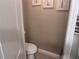 A half bath featuring a neutral wall color and modern fixtures at 2610 Gadsen Walk, Duluth, GA 30097