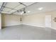 Spacious two-car garage with ample storage space and an epoxy floor at 8265 Majors Glen Ct, Cumming, GA 30041