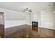 Spacious living room with built-in shelving, fireplace, and hardwood floors at 8265 Majors Glen Ct, Cumming, GA 30041