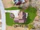 An aerial view shows the home's roof, pristine lawn, and backyard landscaping at 3207 Haleys Way, Conyers, GA 30013