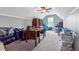 Finished attic space with neutral walls, carpet, and ceiling fan; ample storage options available at 3207 Haleys Way, Conyers, GA 30013