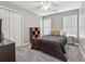 Bedroom with plush carpet, natural light, and closet at 3207 Haleys Way, Conyers, GA 30013