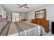 Bedroom featuring neutral walls, carpeted floors, and a decorative bed frame at 3207 Haleys Way, Conyers, GA 30013
