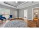 Bright bedroom features a tray ceiling and wood floors, and bathroom access at 3207 Haleys Way, Conyers, GA 30013