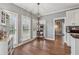 Bright breakfast nook featuring natural light, cabinet storage, and hardwood floors at 3207 Haleys Way, Conyers, GA 30013