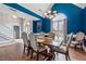 Formal dining room featuring wood floors, large windows, and an elegant chandelier at 3207 Haleys Way, Conyers, GA 30013