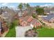 Charming brick home with a manicured lawn, circular driveway, and mature landscaping at 3207 Haleys Way, Conyers, GA 30013