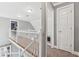 Upstairs hallway features white wood railing and carpet floors at 3207 Haleys Way, Conyers, GA 30013