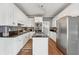 Modern kitchen with stainless steel appliances, granite countertops, and ample cabinet space at 3207 Haleys Way, Conyers, GA 30013