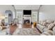 Inviting living room featuring a cozy fireplace, vaulted ceiling, and neutral decor for a relaxing atmosphere at 3207 Haleys Way, Conyers, GA 30013