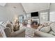 Inviting living room boasts vaulted ceilings, a fireplace, and stylish decor at 3207 Haleys Way, Conyers, GA 30013