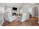 Cozy living room featuring a fireplace, neutral tones, and comfortable seating at 3207 Haleys Way, Conyers, GA 30013