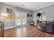 Comfortable sitting room with a fireplace, modern decor, and access to the backyard through glass doors at 3207 Haleys Way, Conyers, GA 30013