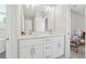 Bathroom featuring a double vanity with ample storage and modern faucets at 8023 White Stone Blvd, Douglasville, GA 30135