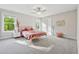 Spacious bedroom with two windows and carpeted floors at 8023 White Stone Blvd, Douglasville, GA 30135