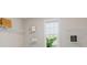A walk-in closet with white shelving and a bright window at 8023 White Stone Blvd, Douglasville, GA 30135