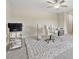 Spacious home office featuring gray carpet, white furniture and ceiling fan at 8023 White Stone Blvd, Douglasville, GA 30135