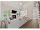 Spacious living room featuring a fireplace, hardwood floors, and an open concept design at 8023 White Stone Blvd, Douglasville, GA 30135