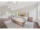 Large main bedroom with vaulted ceilings, a ceiling fan, and a light-filled windows at 8023 White Stone Blvd, Douglasville, GA 30135