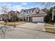 Charming two-story home with a manicured lawn and attached two-car garage at 1481 Wild Rye Ln, Grayson, GA 30017