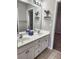 Bathroom featuring double sinks, a large mirror, and plenty of counter space at 2571 Royston Dr, Duluth, GA 30097