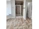 Bathroom with tiled walk-in shower, tile flooring, and soaking tub at 2571 Royston Dr, Duluth, GA 30097