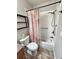 Bathroom with tiled shower/tub combo and matching tiled floor at 2571 Royston Dr, Duluth, GA 30097