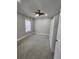 This bedroom has neutral paint with carpet and a closet for storage at 2571 Royston Dr, Duluth, GA 30097