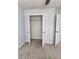 Bedroom closet with shelving and open doors at 2571 Royston Dr, Duluth, GA 30097
