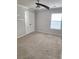 Bedroom featuring a ceiling fan, a window with blinds and closet at 2571 Royston Dr, Duluth, GA 30097