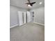 This bedroom has neutral paint with carpet and a closet for storage at 2571 Royston Dr, Duluth, GA 30097