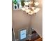 View of the chandelier in the foyer down to the front door of the home at 2571 Royston Dr, Duluth, GA 30097