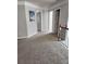 Second floor hallway featuring neutral carpeting at 2571 Royston Dr, Duluth, GA 30097