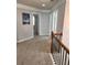 Bright hallway with neutral carpet and decor at 2571 Royston Dr, Duluth, GA 30097