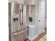 Modern stainless steel refrigerator with water dispenser in a stylish kitchen at 2571 Royston Dr, Duluth, GA 30097
