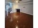 Spacious living room with hardwood floors, a fireplace, and an open layout, ideal for entertaining at 2571 Royston Dr, Duluth, GA 30097