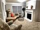 Comfortable living room showcasing fireplace, plush seating, and ample natural light at 2571 Royston Dr, Duluth, GA 30097