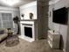 Cozy living room features a fireplace with white mantle and modern decor at 2571 Royston Dr, Duluth, GA 30097