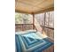 Comfortable screened porch with a decorative rug and wooded views at 2571 Royston Dr, Duluth, GA 30097