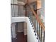 Open staircase with iron spindles and wooden handrail at 2571 Royston Dr, Duluth, GA 30097