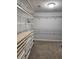 Walk-in closet featuring customizable storage solutions including shelves and drawers at 2571 Royston Dr, Duluth, GA 30097