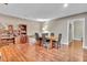 Bright dining room boasting hardwood floors and a large table with seating for six at 317 Sawyer Meadow Way, Grayson, GA 30017