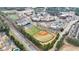 Aerial view of a sports complex, pond, and townhome community at 2368 Saint Davids Nw Sq # 4, Kennesaw, GA 30152