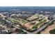 Breathtaking aerial view of a lush green golf course winding through a scenic landscape at 2368 Saint Davids Nw Sq # 4, Kennesaw, GA 30152