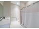 Neutral bathroom with white tiled floors, white shower curtain and matching vanity at 2368 Saint Davids Nw Sq # 4, Kennesaw, GA 30152