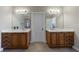 Elegant bathroom featuring double sinks, spacious mirrors and tiled flooring at 2368 Saint Davids Nw Sq # 4, Kennesaw, GA 30152