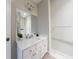 Bright bathroom featuring a white vanity with ample storage and a large mirror at 2368 Saint Davids Nw Sq # 4, Kennesaw, GA 30152